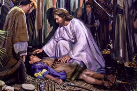 Jesus healing a small boy.